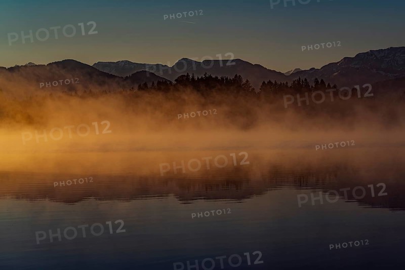 Autumnal morning atmosphere at Schmutter Weiher with fog near Lechbruck, Halblech and Roßhaupten in Allgäu, Bavaria, Germany