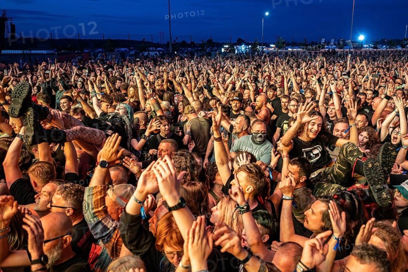 JAROCIN, POLAND - JULY 18, 2025: Jarocin Festival 2025 with rock music. Crowd surfing man on the hands of fans