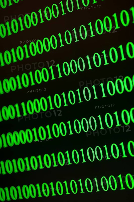 Vertical and diagonal binary numbers in green, conveys IT world