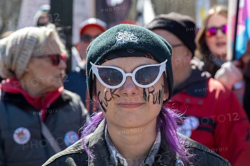 Detroit, Michigan USA - 28 March 2026 - People gathered at more than 100 'No Kings' rallies across Michigan. They were fighting to preserve democratic institutions, and protesting President Trump's actions against immigrants and getting the U.S. into a new foreign war