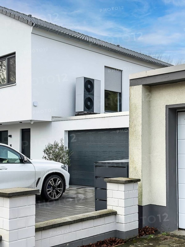 Heat pumps on the garage roof of a detached house in Hilden, Germany