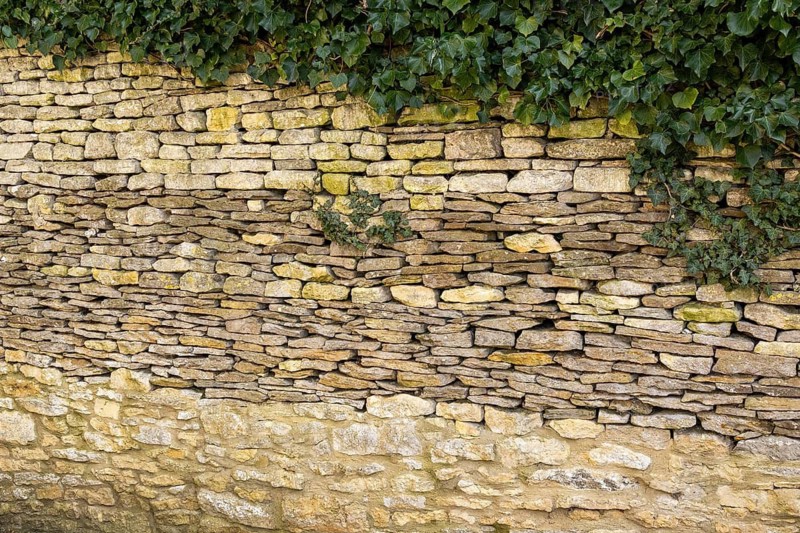 Stone wall, ivy, Bibury, The Cotswolds, England, Great Britain