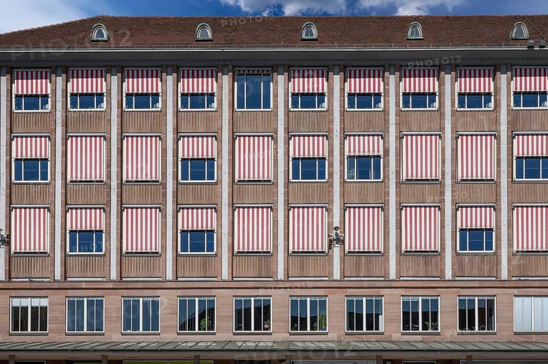 1950s façade of the New Town Hall with lowered red and white blinds on a summer's day, Hauptmarkt, Nuremberg, Middle Franconia, Bavaria, Germany