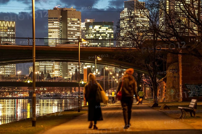 Skyline of the city centre of Frankfurt am Main, cycle and footpath, promenade, along the river Main, dusk, Hesse, Germany