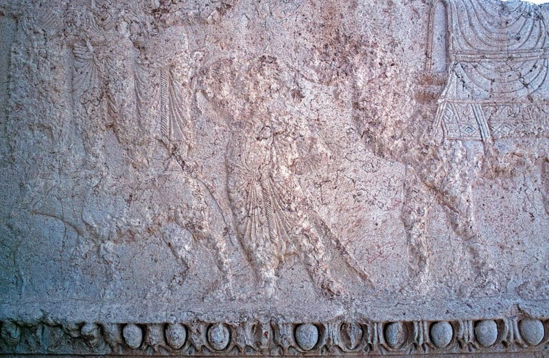Battle of a dragon with a god on his chariot in the presence of other deities, Bel Temple, Palmyra, Tadmor, Syria, May 1987, vintage, retro, old, historical