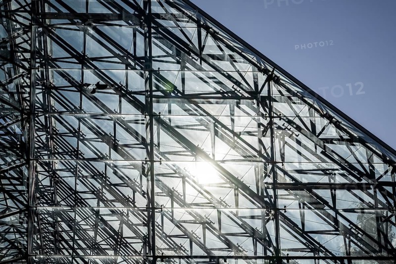 Sun is reflected in the glass canopy designed by architects Kjell Lund and the Lund & Slaatto office above the ruins of the cathedral in Hamar, Domkirkeodden peninsula in Lake Mjøsa, Innlandet province, Hamar, Norway