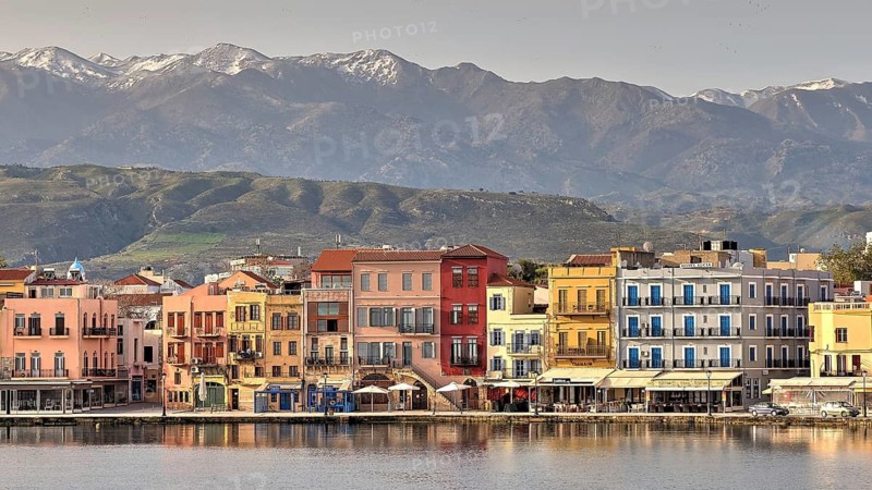 Lefka Ori, White Mountains, Snowy Mountains, Venetian Old Town, Venetian Port, Row of Houses, Colourful Houses, Calm Sea, Blue Sea, Grey Blue Sea, Blue Cloudless Sky, Chania, West Crete, Island of Crete, Greece