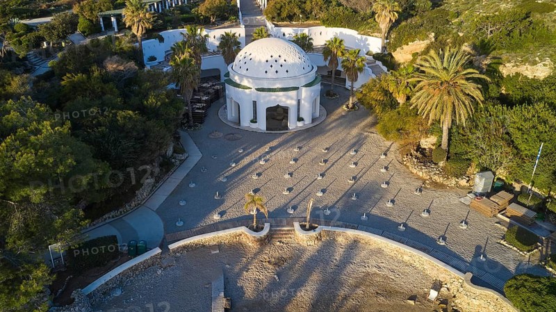 Drone shot, morning light, White building with dome and arched windows, surrounded by palm trees on a paved square, Kalithea, Kallithea, thermal baths, thermal baths, Rhodes, Dodecanese, Greek Islands, Greece