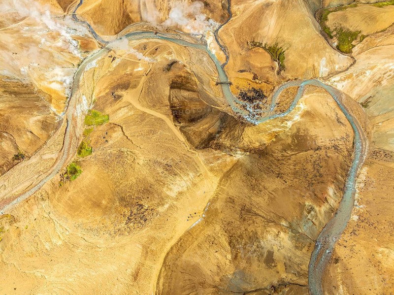 Steaming hot springs and colourful rhyolite mountains, aerial view, Hveradalir geothermal area, Kerlingarfjöll, Icelandic highlands, Iceland