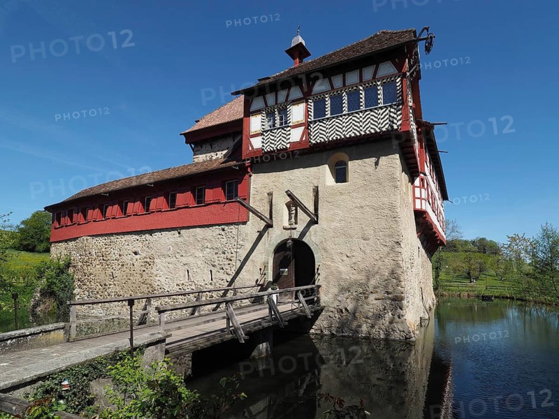 Timbered structure on a castle with wooden drawbridge and moat, Hagenwil moated castle, Hagenwil, Amriswil, Canton of Thurgau, Lake Constance region, Switzerland