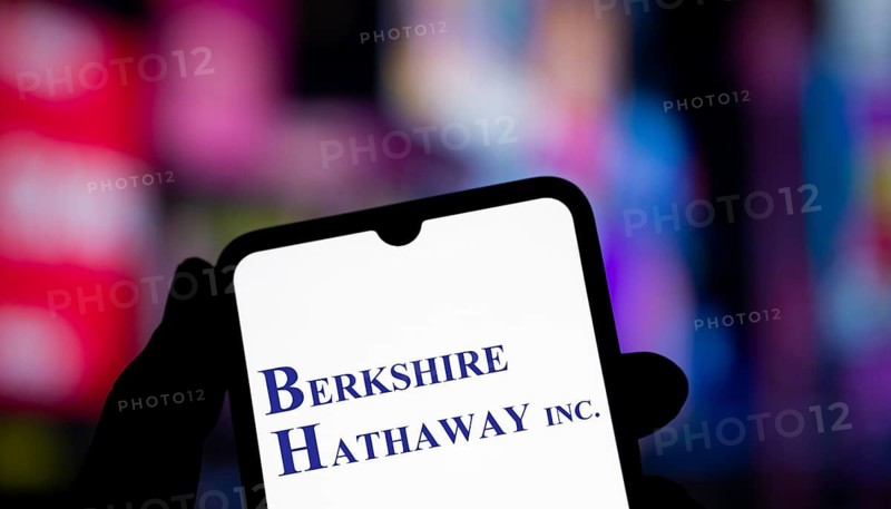 Berkshire Hathaway inc logo is displayed on smartphone. Berkshire Hathaway Inc is an American multinational conglomerate holding company