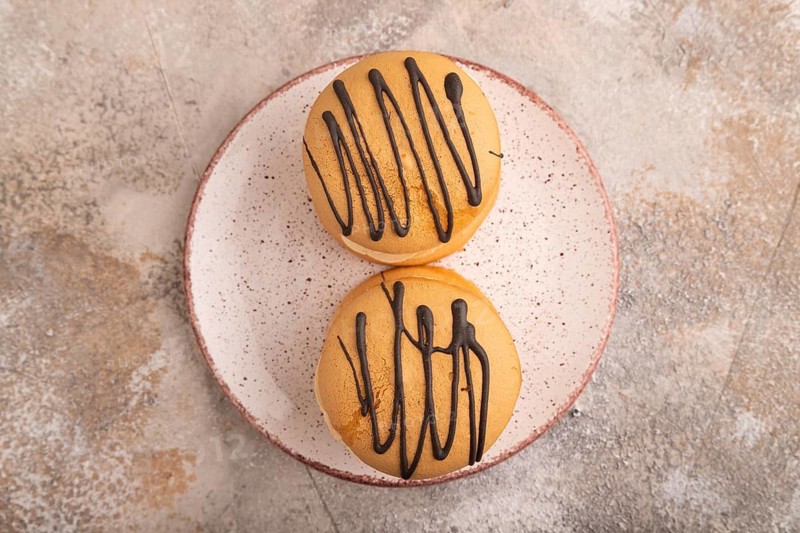 Caramel Cream Cakes on brown concrete background, top view, flat lay, close up