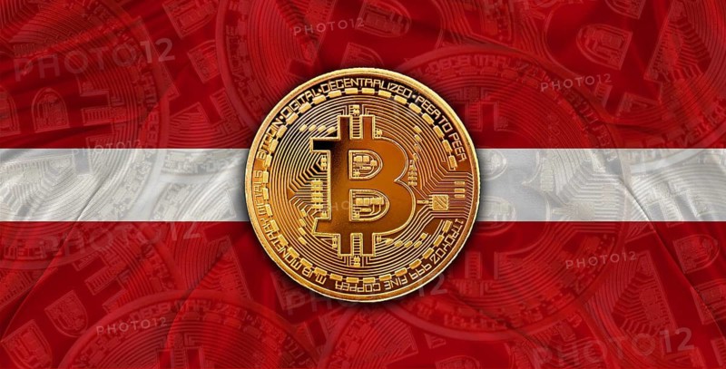 Investors in Blockchain Technology with Latvia flag background. Bitcoin cryptocurrency with Latvian flag