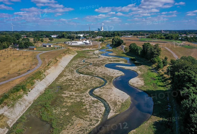 Recklinghausen, Castrop-Rauxel, North Rhine-Westphalia, Germany, EMSCHERLAND construction project, a 37-hectare water and nature discovery park at the water crossroads of the Rhine-Herne Canal and the renaturalised Emscher on the city limits of Recklinghausen and Castrop-Rauxel. The ecological focal point at the confluence of the Suderwicher Bach (left) and Emscher (right) will also be a future garden for the International Garden Exhibition 2027. Before the renaturalisation, the Emscher river system was an open, above-ground wastewater channel, combined sewer with surface water and wastewater. The Uniper power plant Datteln 4 in the background