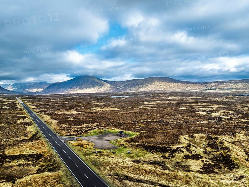 Moors and Road A82 over Glencoe Valley from a drone, Highland, Scotland, United Kingdom