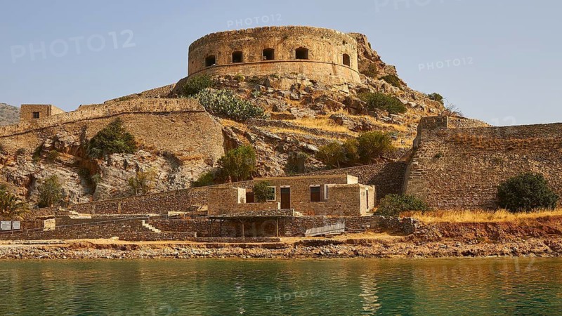 An ancient fortress with a round tower and walls surrounded by water, Venetian Sea Fortress, Leper Island, Spinalonga, Elounda Bay, Mirabello Bay, East Crete, Crete, Greek Islands, Greece
