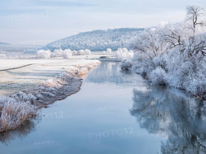 The river Unstrut in the Unstrut valley in winter, fields, trees and forests covered with hoarfrost, Memleben, Saxony-Anhalt, Germany
