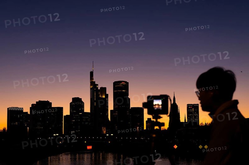 The silhouette of Frankfurt's banking skyline stands out in the evening against the residual light of the setting sun, Frankfurt am Main, Hesse, Germany