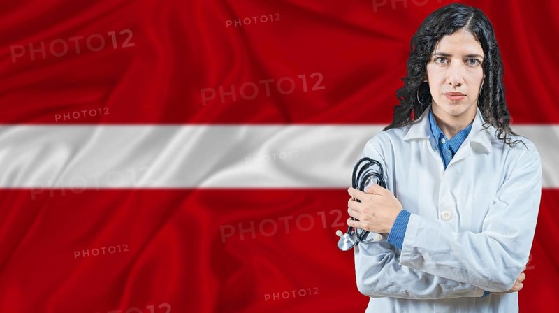 Latvian national health system, Medical professional on Latvia flag background