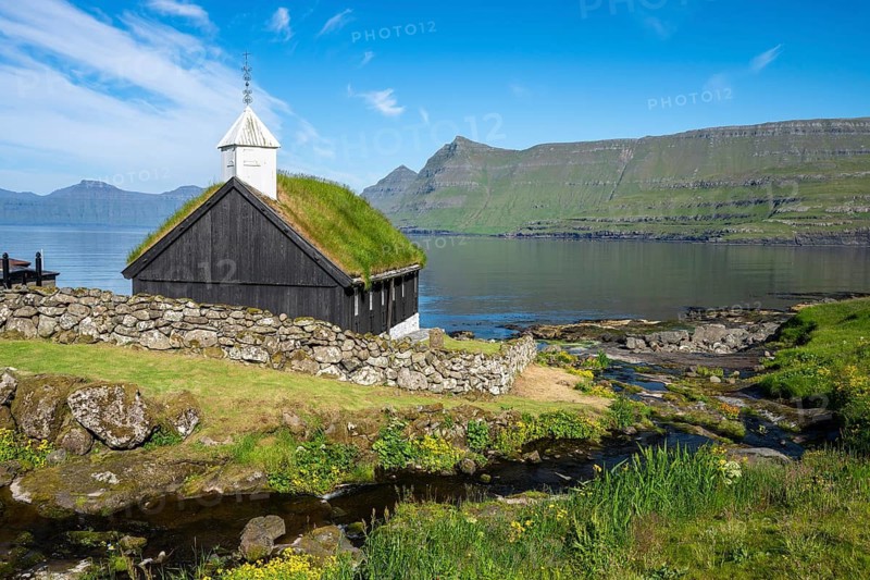 Funningur wooden church, church with grass roof on the fjord, Eysturoy island, Faroe Islands, Denmark