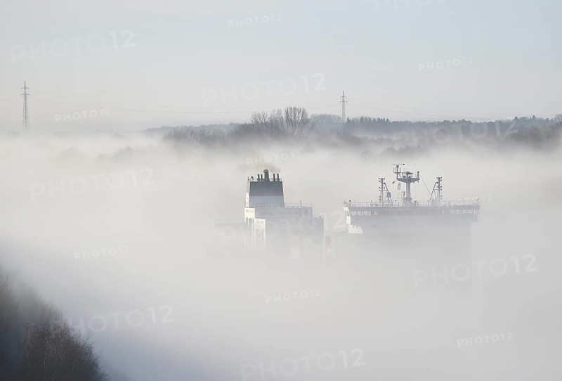 Container ship CMA CGM TIVOLI sailing in fog in the Kiel Canal, NOK, Kielkanal, Kiel Canal, Schleswig-Holstein, Germany