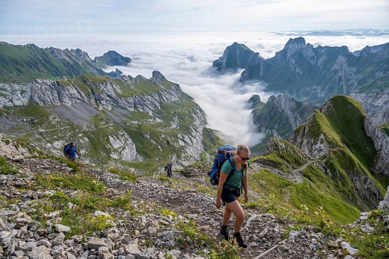 Hiker on hiking trail to Säntis, Appenzell Ausserrhoden, Appenzell Alps, Switzerland