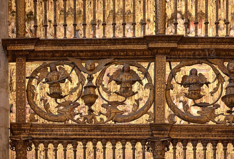 Golden decorative angel reliefs in religious context, Seville, Andalusia, Spain