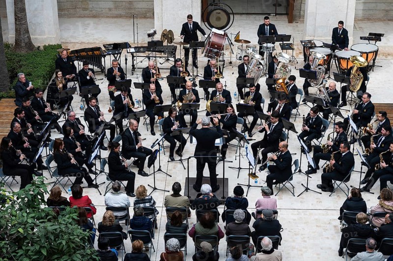 MALAGA, SPAIN - FEBRUARY 1, 2026: Elevated view of a classical orchestra performing in a circular formation in a spacious courtyard Museo de Malaga, surrounded by seated audience