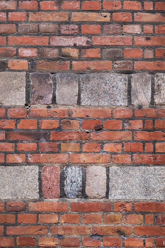 Wall with red bricks and hewn natural stone, Copenhagen, Denmark