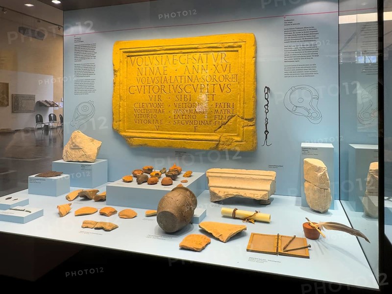 Showcase with ancient Roman tablets Exhibits on the subject of writing in Roman times in the Museum of Aguntum the only Roman town in East Tyrol, Lienz, Austria