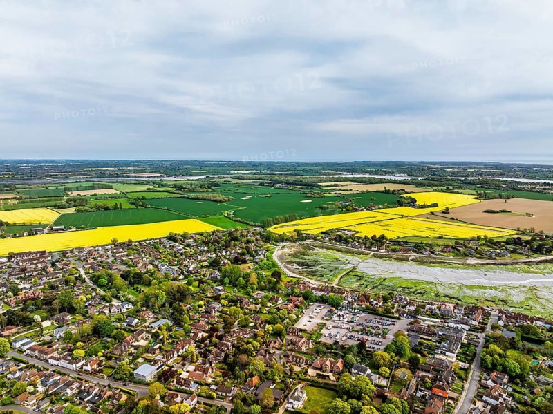 Fields and Farms over Bosham Quay from a drone, Chichester Harbour National Landscape, Chichester, West Sussex, England, United Kingdom
