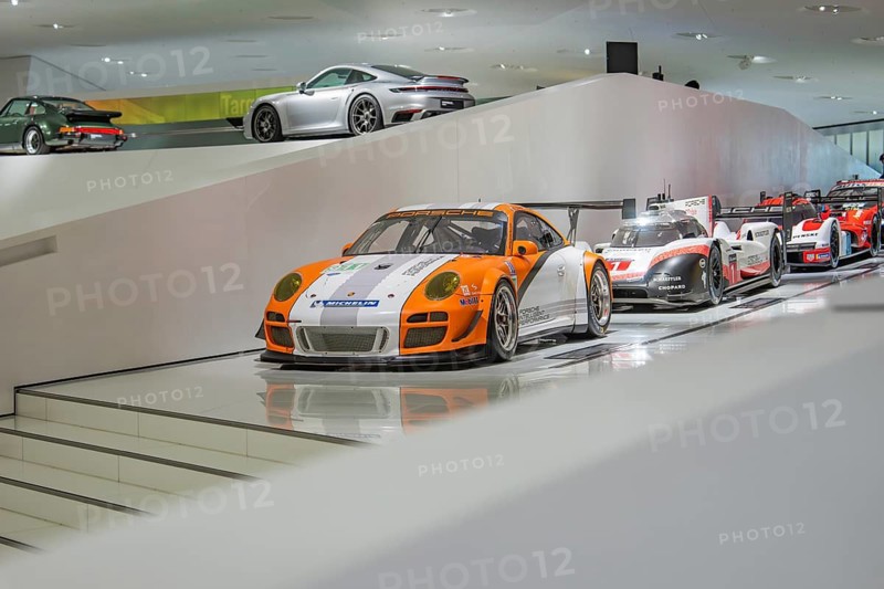 Row of Porsche racing cars in exhibition hall, Porsche Museum, Stuttgart, Germany