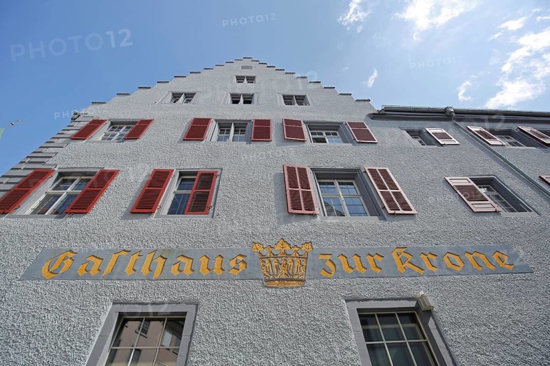 Historic Gasthaus zur Krone built in 1505 with stepped gable, view upwards, yellow, golden, inscription, red shutters, Krone, Überlingen, Überlinger See, Lake Constance area, Baden-Württemberg, Germany
