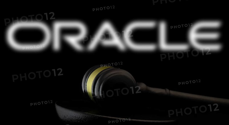 Court gavel in front of the Oracle logo. Oracle Corporation is an American multinational computer technology company.