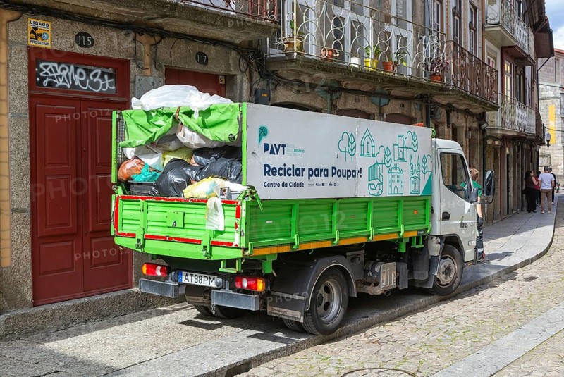 Waste refuse collection service in city centre street, Guimaraes, northern Portugal