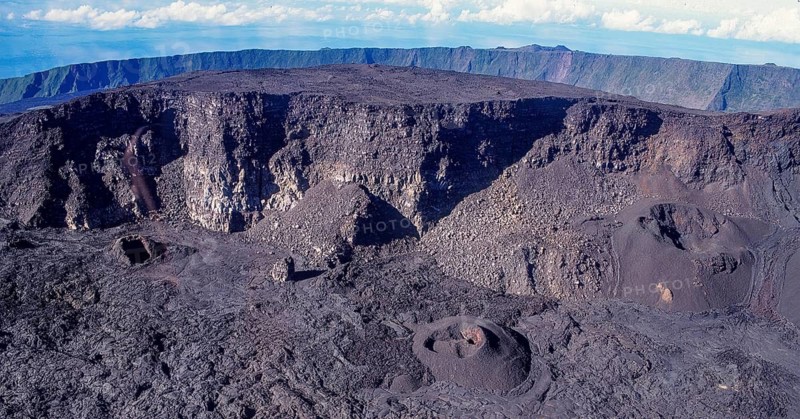 Aerial view of Cratère Dolomieu main crater from 2632 m high shield volcano Piton de la Fournaise volcano on Reunion island, French overseas department overseas department, Indian Ocean