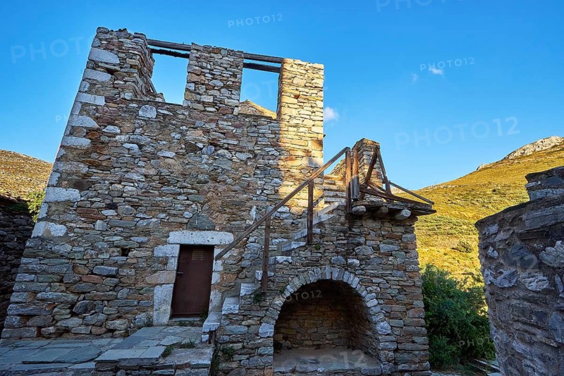 Ruins of a building with arched doorways and detailed stonework, Vathia, residential tower village, Mani peninsula, Peloponnese, Greece