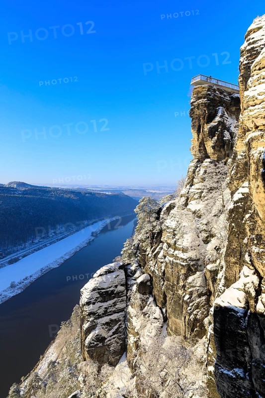 View from the Bastei Bridge into the Elbe Valley and to the floating viewing platform of the Bastei View on a winter morning, Saxon Switzerland, Saxony, Germany
