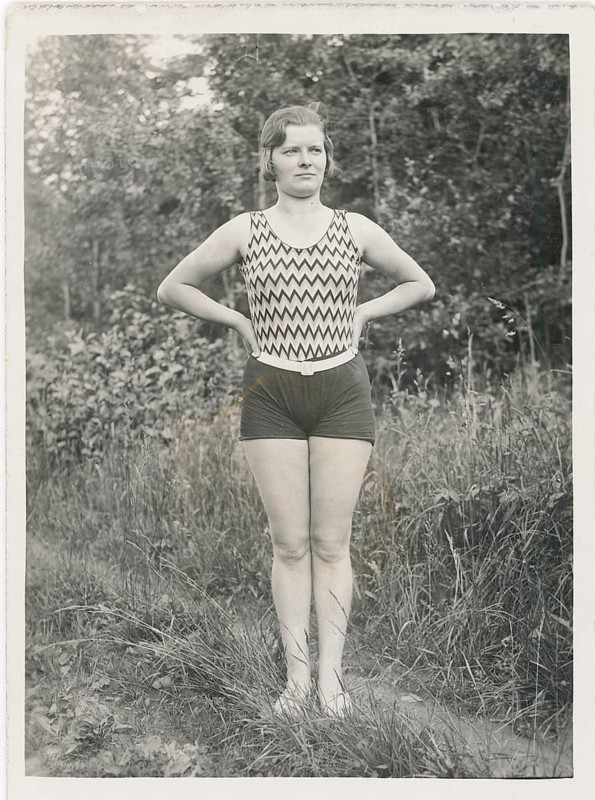 Bathing, swimwear, leisure, summer, A woman in a patterned swimsuit standing outdoors with her arms crossed, around 1930