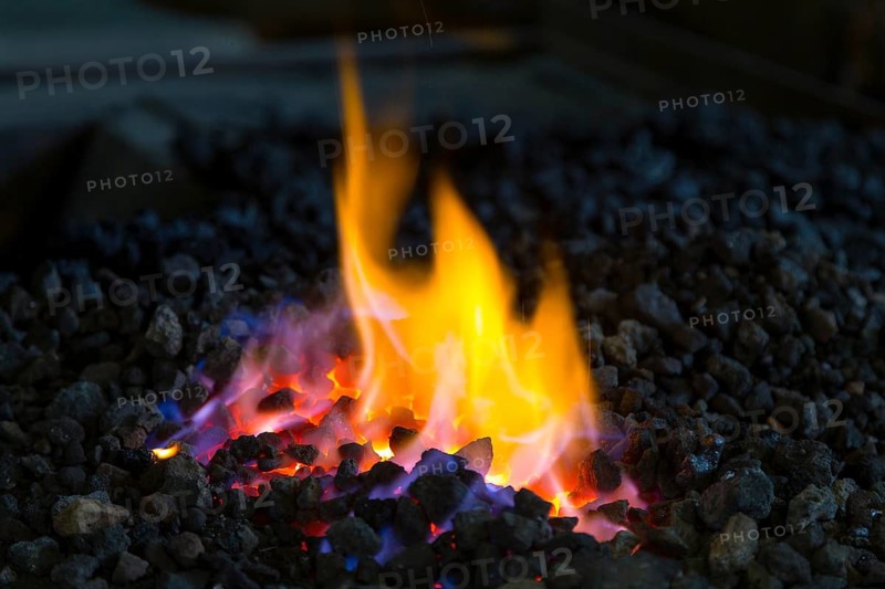A blacksmith forging, working at the Ehnert forge in Dresden-Bühlau, Saxony, Germany