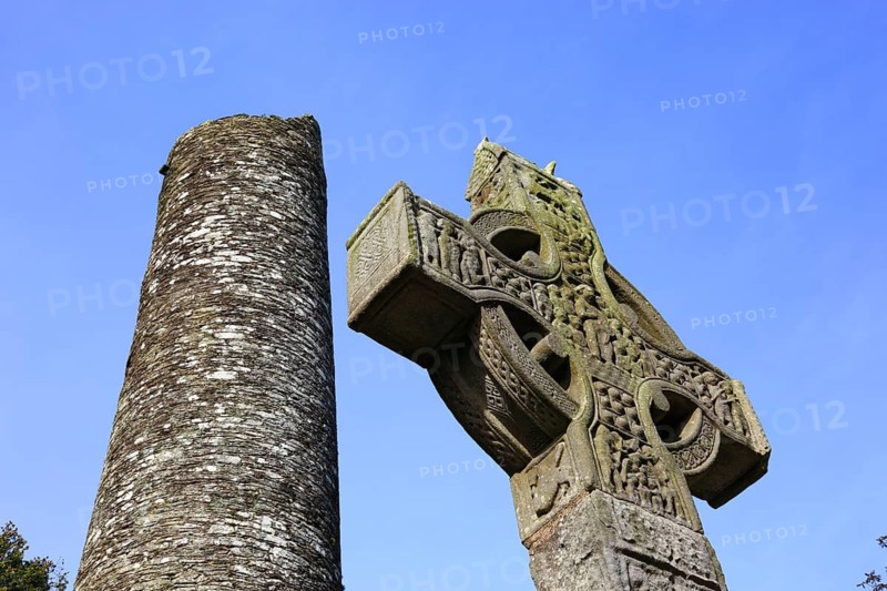 High Cross Cross of Muiredach, Round Tower, Mainistir Bhuithe, Monasterboice, a monastery ruin of the Iro-Scottish Church in Ireland in County Louth, founded by Saint Buite/Muiredach's High Cross, Round Tower, Monasterboice, cemetery of the monastery ruins of the Iroscotic Church in Ireland in County Louth, founded by Saint Buite, abandoned in 1097 after a fire, but the cemetery is still in use today, Leinster province, Ireland
