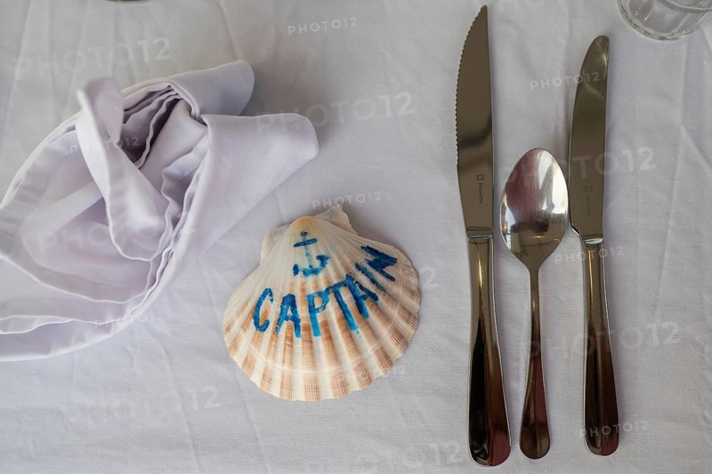 Table set with cutlery, white tablecloth with a mussel with the inscription Captain, Aeolian or Lipari Islands, Sicily, Southern Italy, Italy