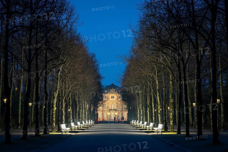The light benches by artist Stefan Sous in the Hofgarten, entitled UV-A UV-B, 14 completely refurbished exhibits from the 2002 light-grey art exhibition, which now stand and light up as a permanent work of art on Jägerhofallee, LED technology, in the background Jägerhof Palace, home of the Goethe Museum, Düsseldorf, North Rhine-Westphalia, Germany