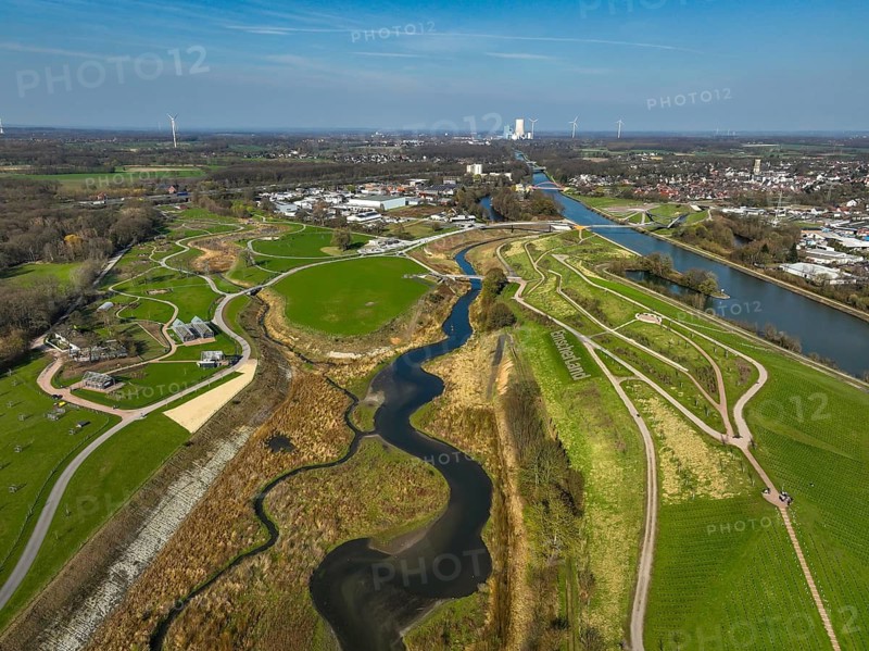 Castrop-Rauxel, North Rhine-Westphalia, Germany - EMSCHERLAND adventure park, new nature and water adventure park on the restored Emscher, at the Emscher water cross with the Rhine-Herne Canal on the city limits of Recklinghausen to Castrop-Rauxel. A new vineyard in front. Flood protection through area expansion. The ecological focus at the confluence of the Suderwicher Bach and Emscher rivers will also be a future garden of the IGA 2027 International Garden Exhibition. Before the restoration, the river system of the Emscher was an open, aboveground waste water channel, mixed water channel with surface water and waste water. Back right, the new bridge jump over the Emscher. On the horizon, the Datteln 4 power plant