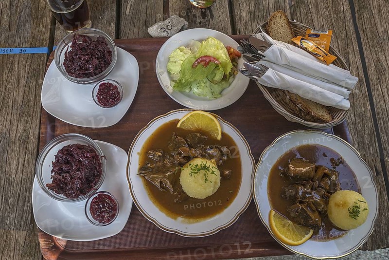 Franconian food is served on a tray in a beer garden, Bavaria, Germany