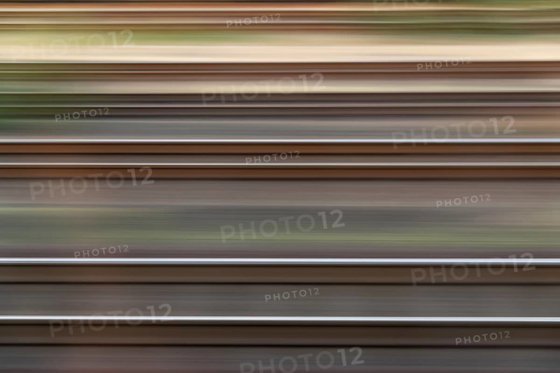 Dynamic view of railway tracks created by linear motion blur, Germany