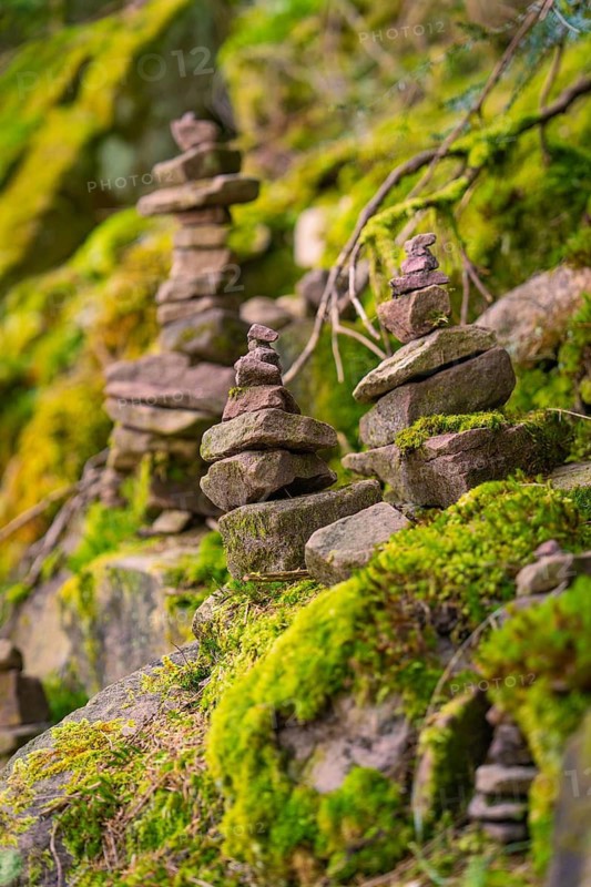 Moss-covered stone towers in a forest that radiate balance and tranquillity, Glaswaldsee, Bad Rippoldsau-Schapbach, Wolfach district, Black Forest, Germany