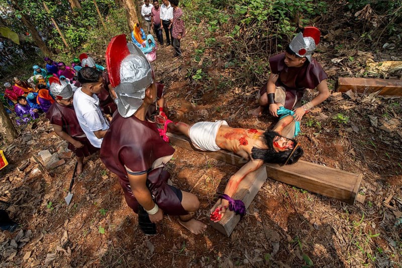 Catholic devotees take part in a re-enact of the crucifixion of Jesus Christ during a Good Friday procession on April 3, 2026 in Guwahati, India. Indian Catholics are celebrating Good Friday along with Roman Catholics around the world, marking the day Jesus Christ was crucified
