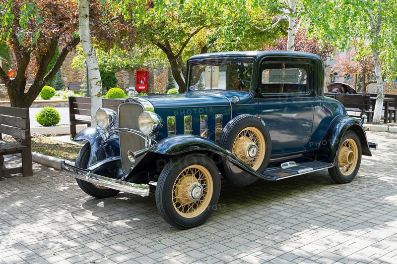 Blue classic car with golden spoked wheels in an autumn parkland, vintage car, Chevrolet Confederate Series BA Coupe, 1932, Milestii Mici Winery, Mile?tii Mici, Republic of Moldova, Moldova