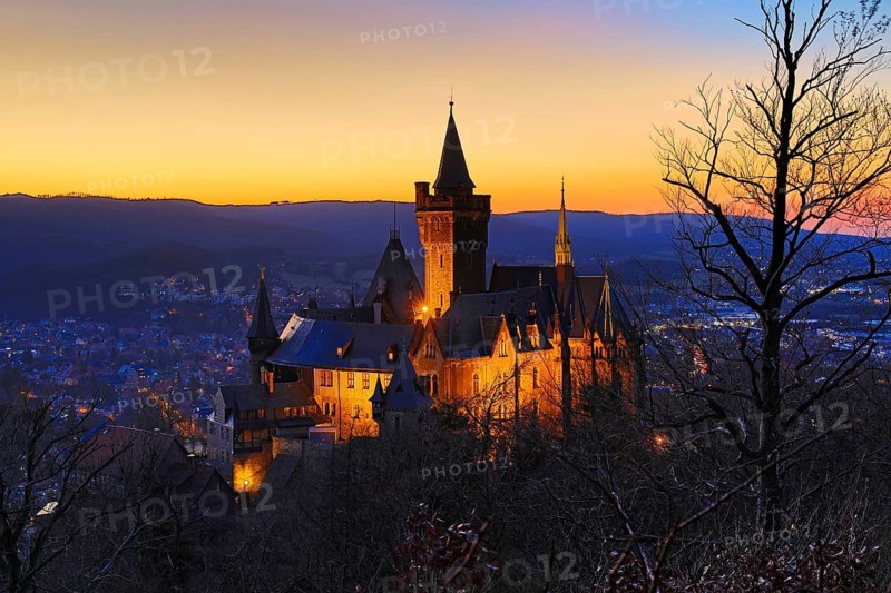 Atmospheric view of the illuminated Wernigerode Castle at sunset, Harz Mountains, Saxony-Anhalt, Germany